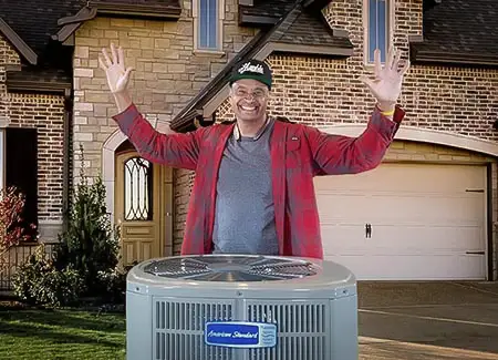 Tyrone Nichols, owner of Nichols & Sons HVAC, shows off a high efficiency American Standard HVAC unit